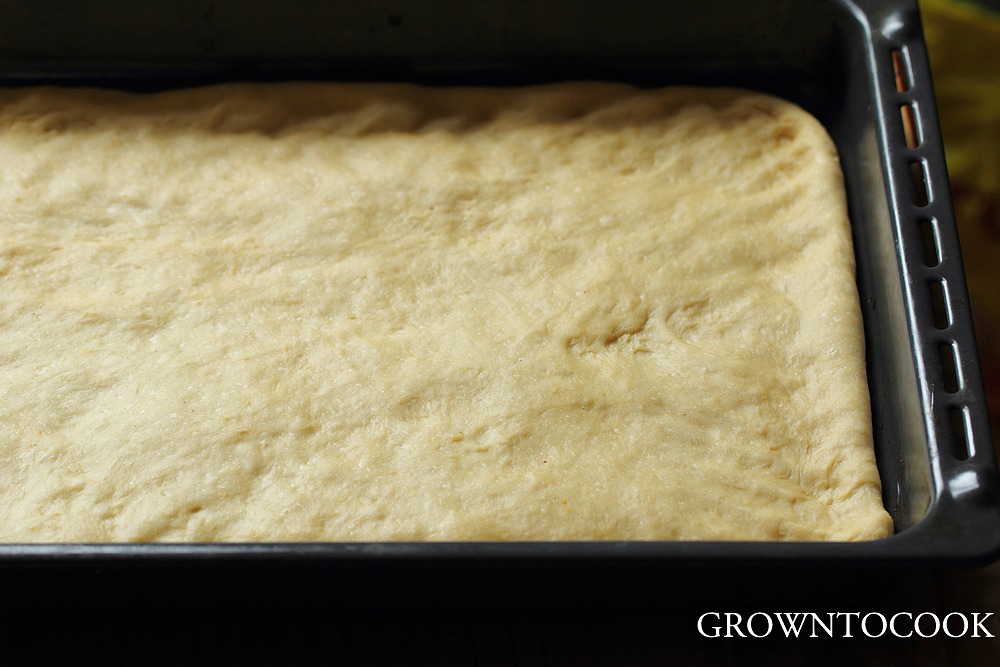 spreading the dough on the baking sheet