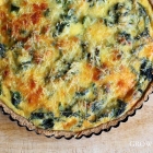 Nettle quiche with sesame seed crust
